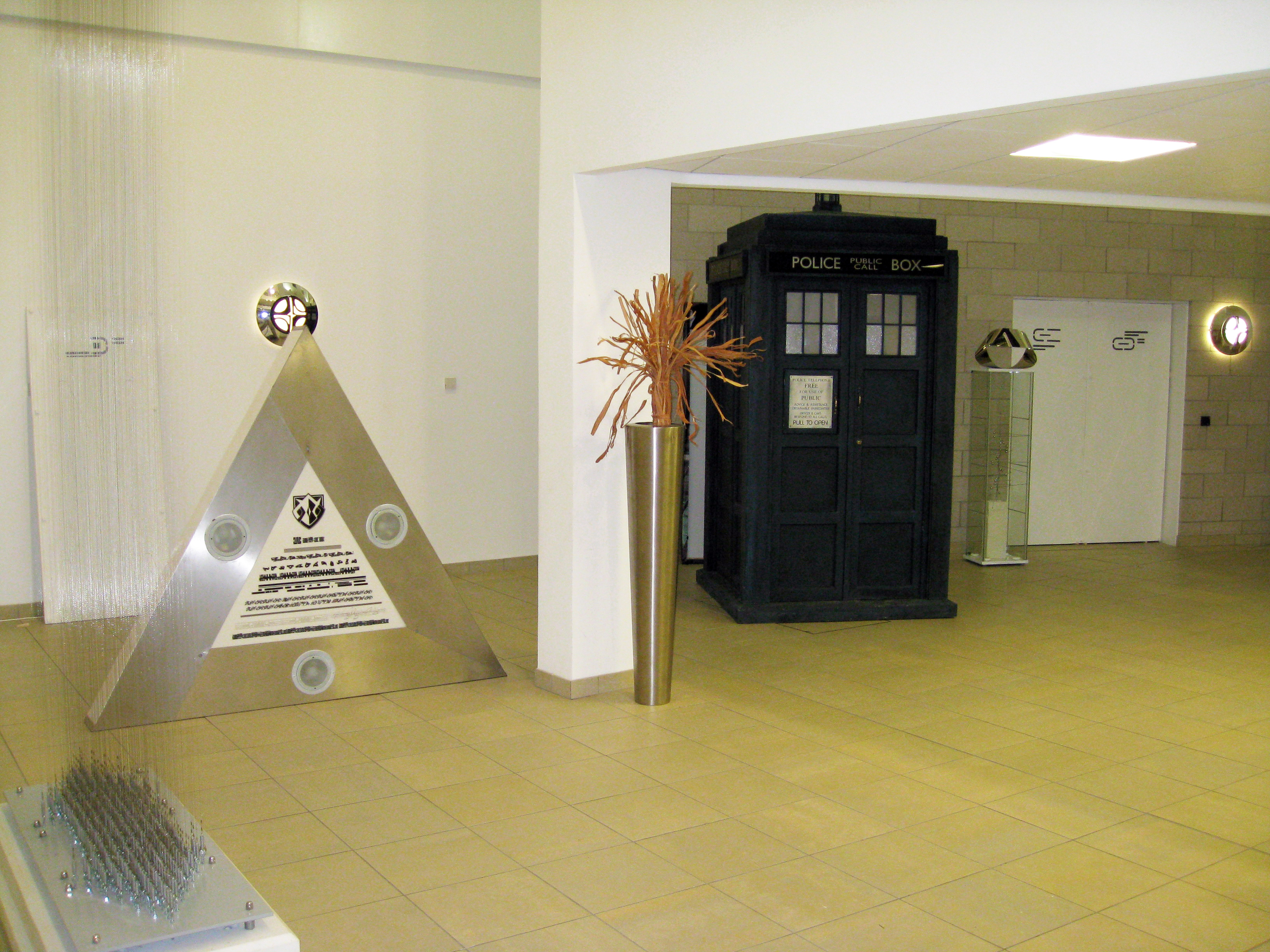 TARDIS next to The Shadow Proclamation logo sign during filming of the Dr Who episode The Stolen Earth, which took place in the Optometry Lobby.